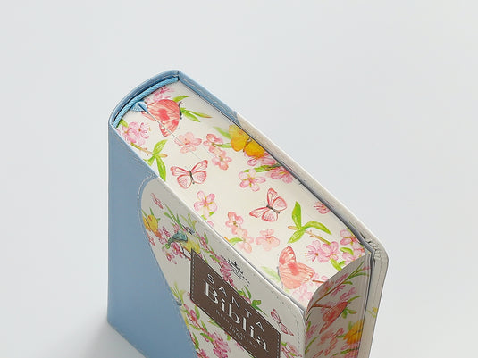Biblia de Bolsillo RVR 1960, imitación piel celeste flores y pájaros