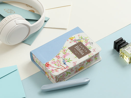 Biblia de Bolsillo RVR 1960, imitación piel celeste flores y pájaros
