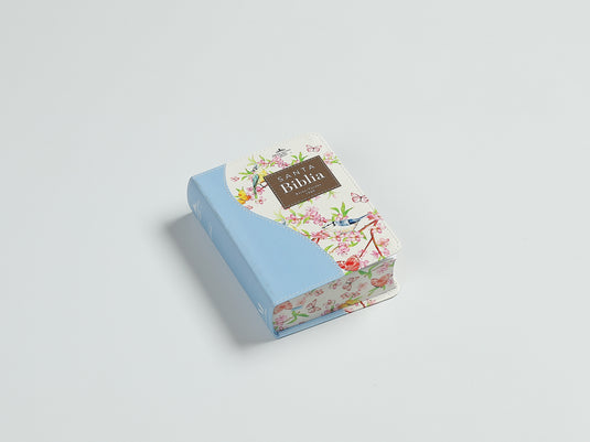 Biblia de Bolsillo RVR 1960, imitación piel celeste flores y pájaros