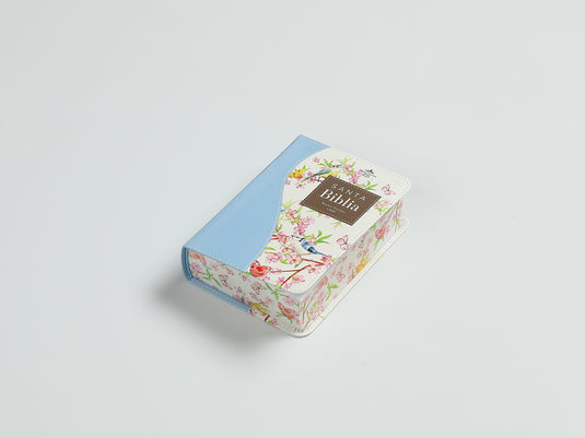 Biblia de Bolsillo RVR 1960, imitación piel celeste flores y pájaros
